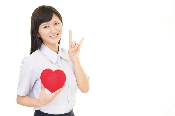 Smiling Woman Holding Red Heart Love Symbol — Stock Photo, Image