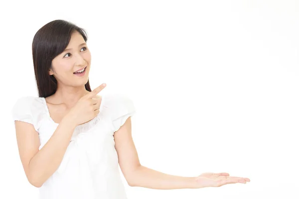 Woman showing something on the palm of her hand