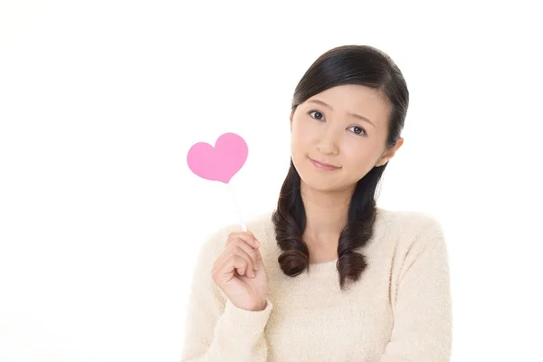 Smiling Woman Holding Pink Heart Love Symbol — Stock Photo, Image