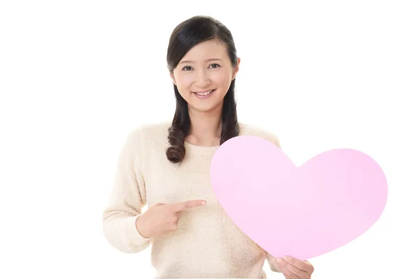 Smiling Woman Holding Pink Heart Love Symbol — Stock Photo, Image