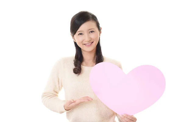 Smiling Woman Holding Pink Heart Love Symbol — Stock Photo, Image