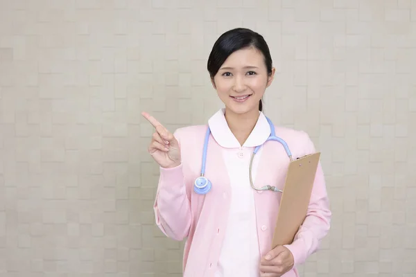 Young Female Nurse Pointing — Stock Photo, Image