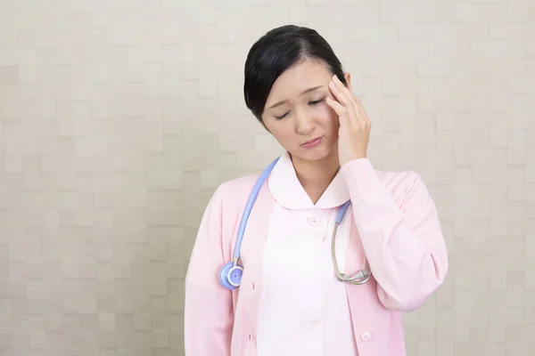 Female Nurse Who Has Headache — Stock Photo, Image