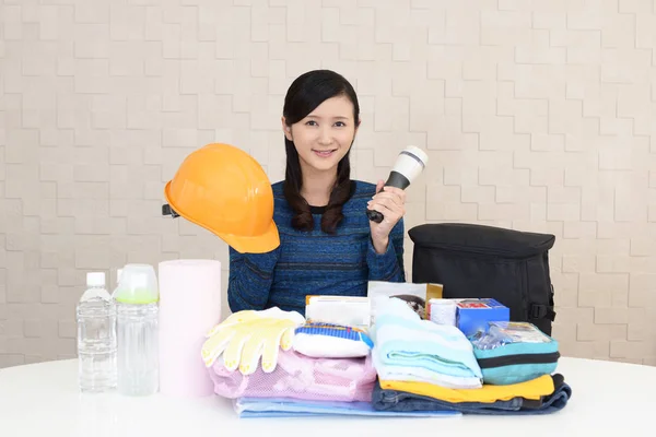 Woman with emergency preparedness kit