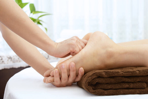 Close-up of woman having reflexology