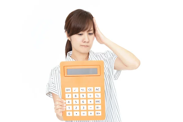 Mujer Decepcionada Con Una Calculadora —  Fotos de Stock