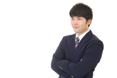 Asyalı işadamı kollarını kavuşturdu.