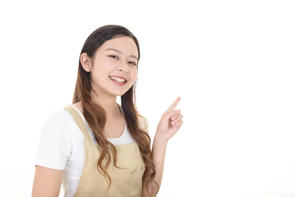 Smiling Asian Housewife Pointing — Stock Photo, Image