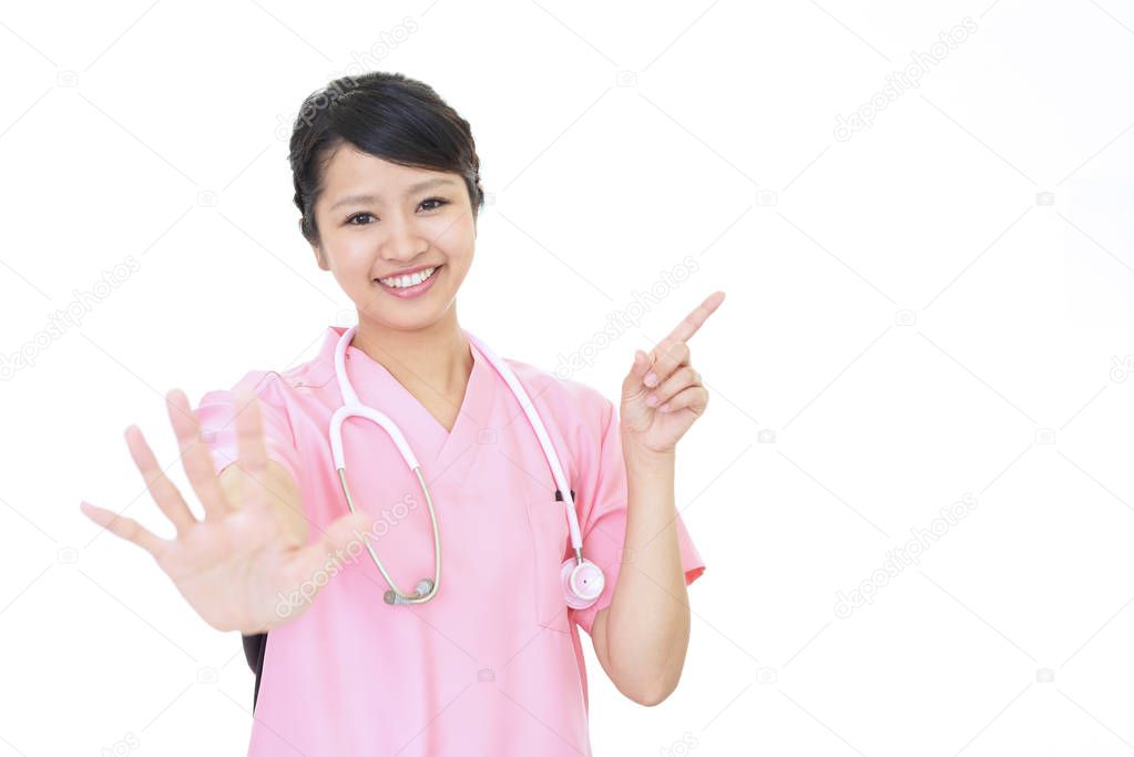 Female nurse making stop sign