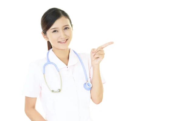 Jonge Vrouwelijke Verpleegster Wijzen — Stockfoto