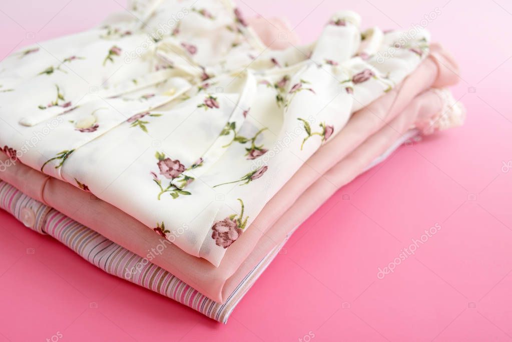 Stylish clothes isolated on pink background