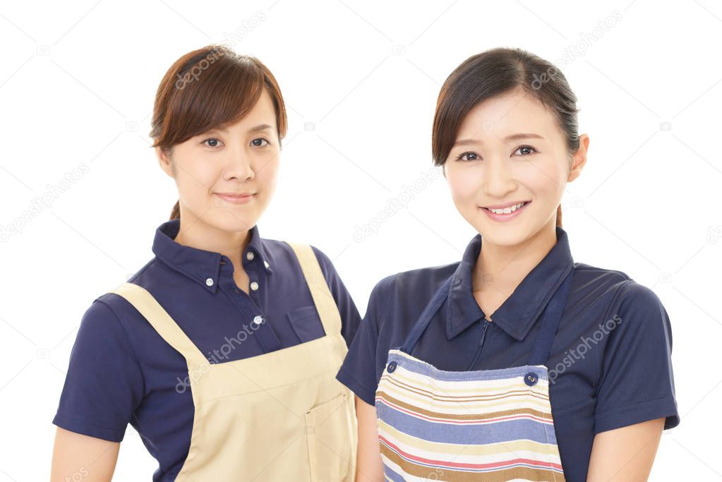Smiling Asian women in apron