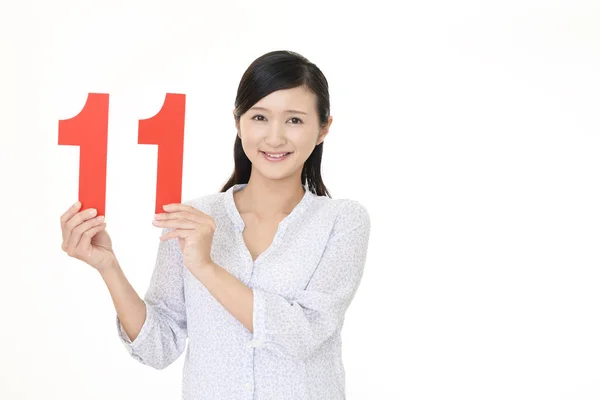 Woman Holding Number Eleven — Stock Photo, Image