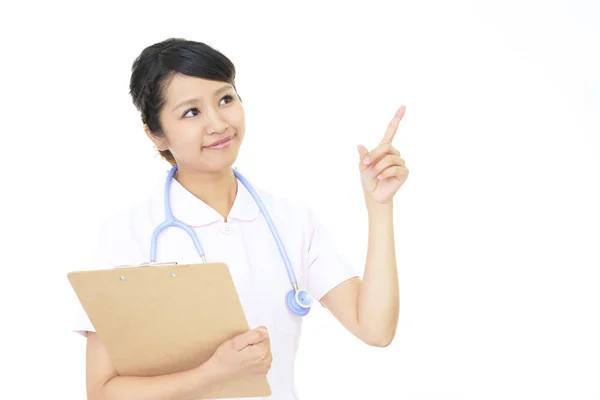 Jovem Enfermeira Apontando — Fotografia de Stock