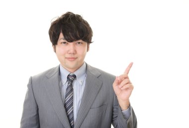 Asya işadamı izole üzerinde beyaz arka plan işaret