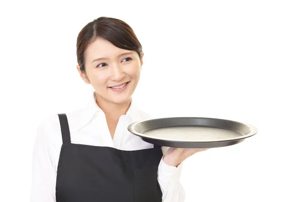 微笑的亚洲女服务员查出在白色背景 — 图库照片