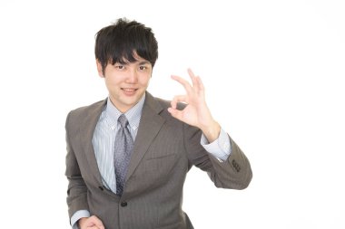 ok el işareti ile işadamı