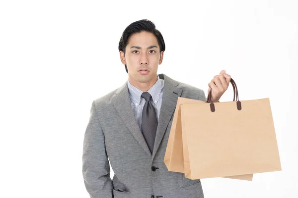 Azjatycki Mężczyzna Trzyma Papierowe Torby Zakupy — Zdjęcie stockowe