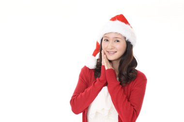 Young woman in Santa Claus cap