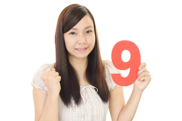 Woman Holding Number Nine — Stock Photo, Image