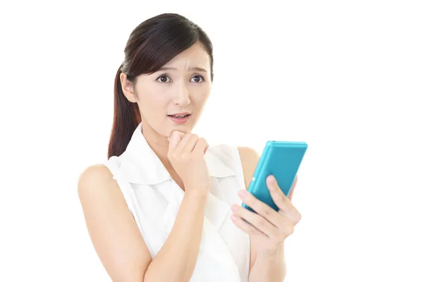 Uneasy Asian Woman Smart Phone — Stock Photo, Image