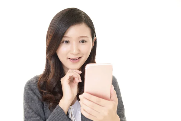 Smiling Woman Using Smartphone — Stock Photo, Image