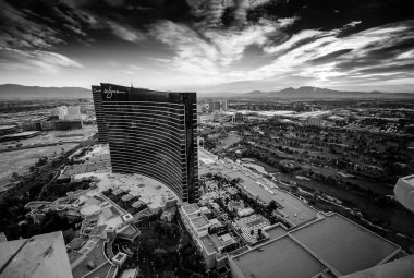 LAS VEGAS, NEVADA, USA - MAY 5, 2014: Working round-the-clock modern Vegas hotels and casinos Wynn and Encore at sunrise aerial view scene in Las Vegas, Nevada on May 5, 2014. clipart