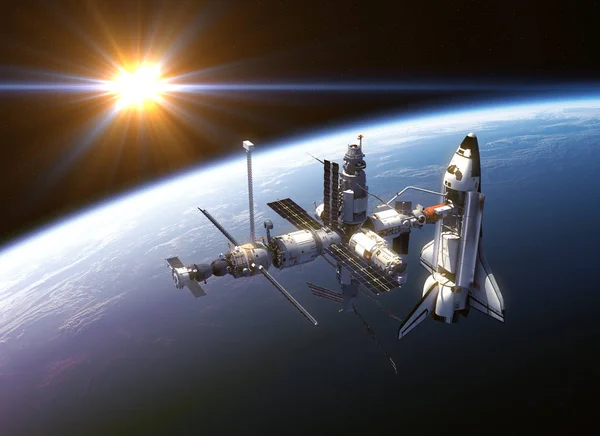 Космический челнок и космическая станция в лучах солнца — стоковое фото