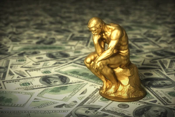 Pensador de escultura de oro sobre dólares americanos verdes —  Fotos de Stock