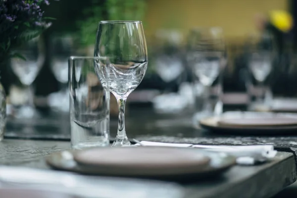 stock image Luxury table settings for fine dining with and glassware, beautiful blurred  background. Preparation for holiday  Christmas and Hannukah dinner night.