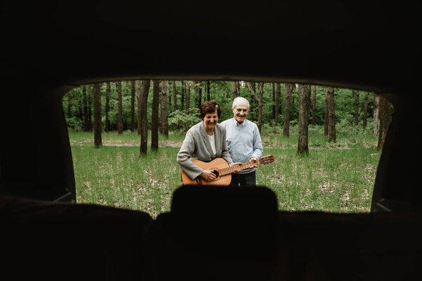 Loving Mature Couple Coming Picnic Guitar Happy Senior Couple Playing Stock Image