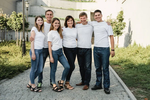 Happy Family White Shirt Jeans Emracing Having Fun Parents Adult — Stock Photo, Image