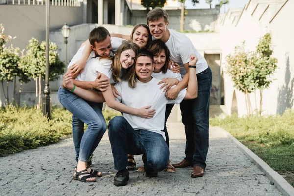 Happy Family White Shirt Jeans Emracing Having Fun Parents Adult — Stock Photo, Image