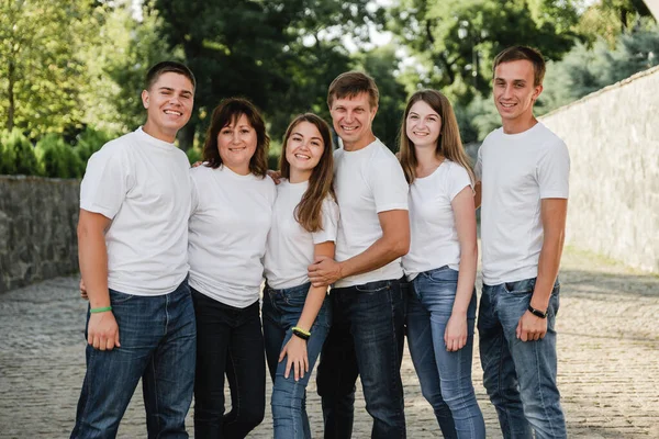 Happy Family White Shirt Jeans Emracing Having Fun Parents Adult — Stock Photo, Image