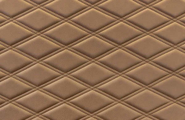 Brown texture of quilted leather upholstery