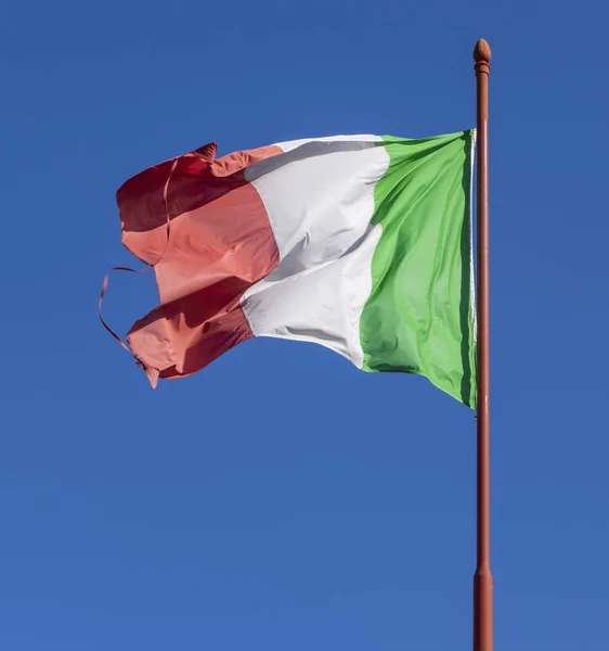 Flag of Italy waving in wind, against clear sky