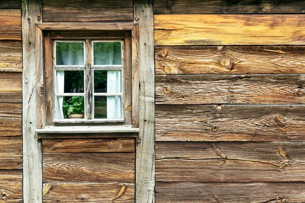 Close up on old cabin wall and window