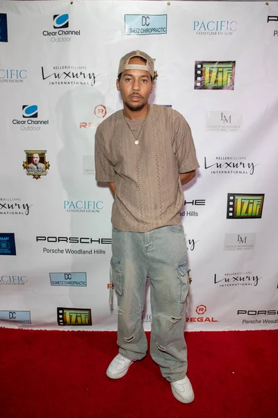 Elijah Washington arrives at the film premiere of 