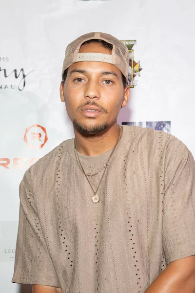 Elijah Washington arrives at the film premiere of 