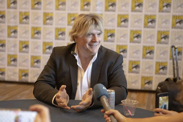 Simon Franglen answers reporters questions at the 11th Annual Musical Anatomy of a Superhero press room during Comic Con International at the Bayfront Hilton Hotel on July 24, 2025.