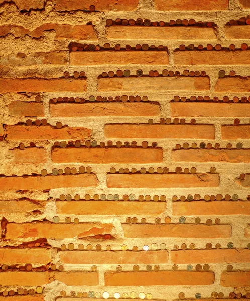 Brick Wall Background Coins Bricks Closeup View — Stock Photo, Image