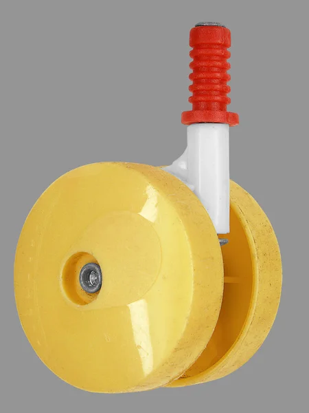 Žluté plastové kolo (pohled zepředu) s červeným tyč pro — Stock fotografie