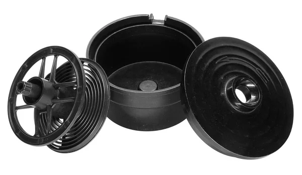 Um tanque fotográfico de plástico preto com uma tampa e uma bobina para — Fotografia de Stock