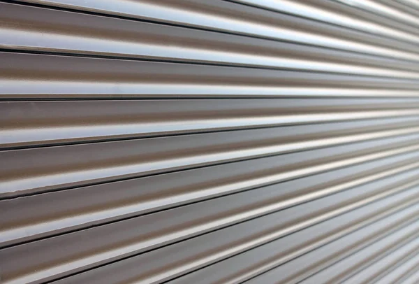 Brown metal shutter door as a pattern and background