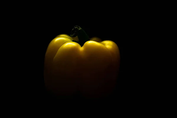 Fresh yellow capsicum paprika isolated on black. Healthy eating concept. — Stock Photo, Image