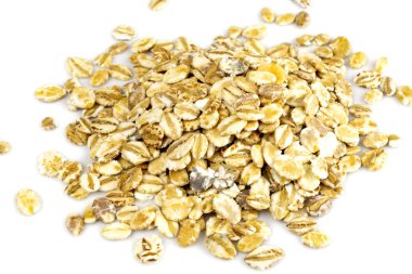 Yulaf gevreği, yulaf ezmesi yığını - Sağlıklı kahvaltı için organik malzemeler.