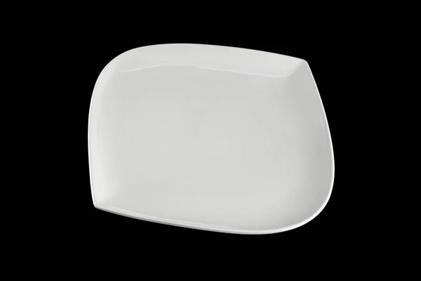 Белый керамический фарфор вид сверху. Пустая тарелка на ужин на тёмном фоне. Чистый круг фарфоровой посуды. Посуда для завтрака . — стоковое фото