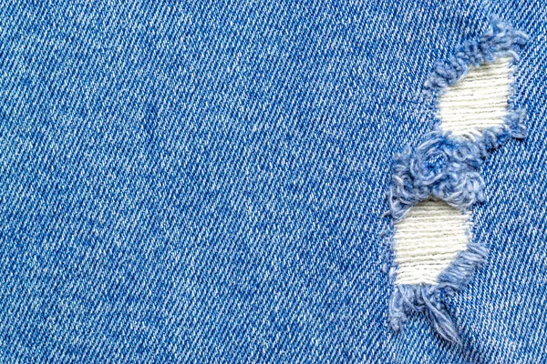 蓝色纹理背景。斜纹棉织物牛仔裤图案与复印空间.近视中的靛蓝面料.时尚棉布 — 图库照片