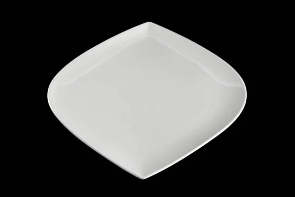 Квадратная белая пустая тарелка для ужина на темном фоне. Блюда изолированы на черном. Ресторан кухня минималистская концепция . — стоковое фото