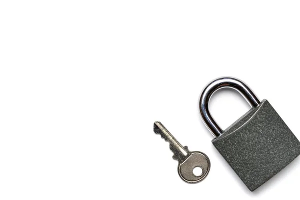 Padlock isolated on white background. Metal lock pad with key, security concept. — Stock Photo, Image